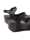 Sandalo in vera pelle con zeppa donna