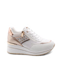 Sneaker zeppa con borchie da donna