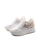Sneaker zeppa con borchie da donna